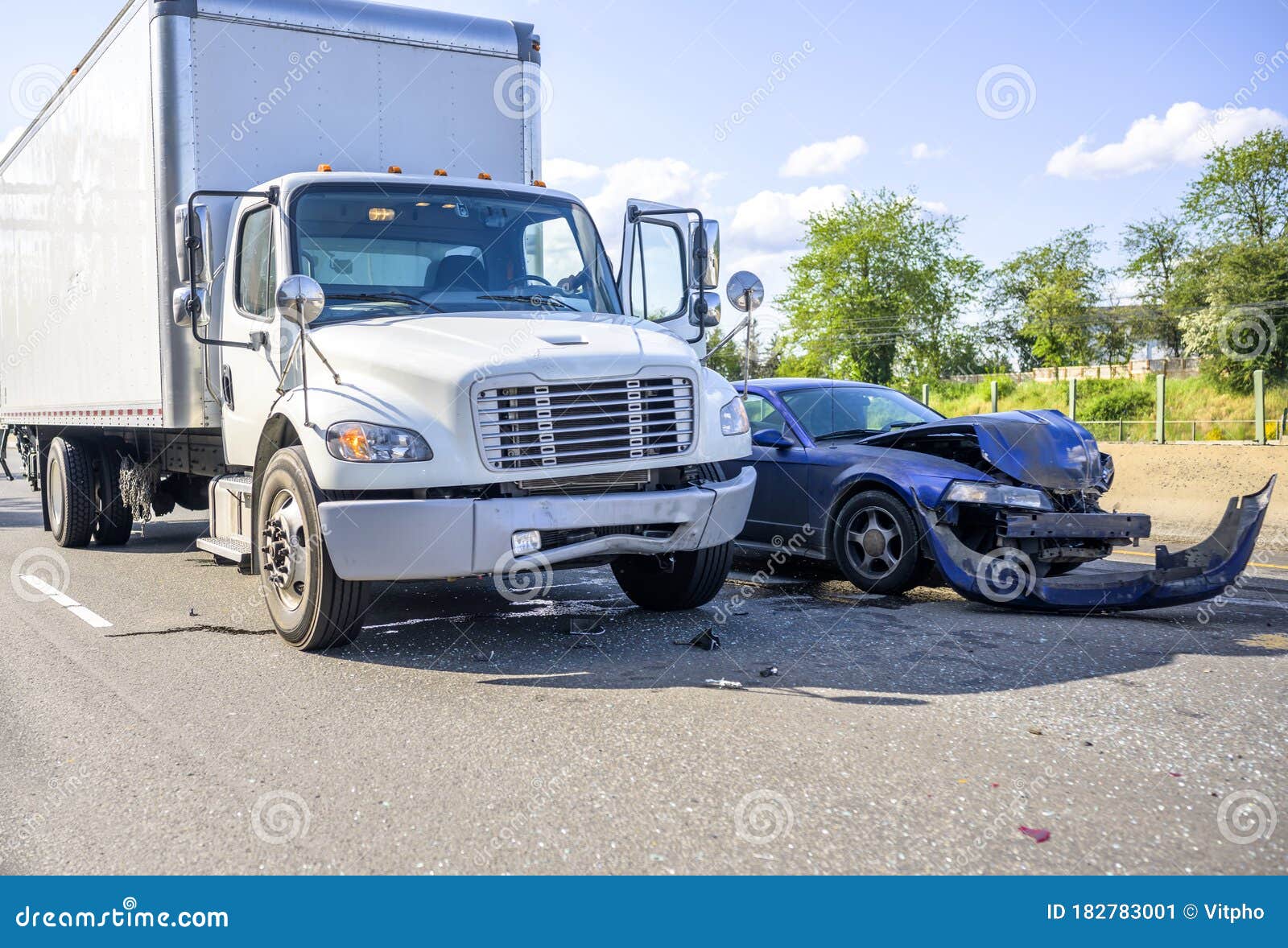road accident with damage to vehicles as a result of a collision between a semi truck with box trailer and a car