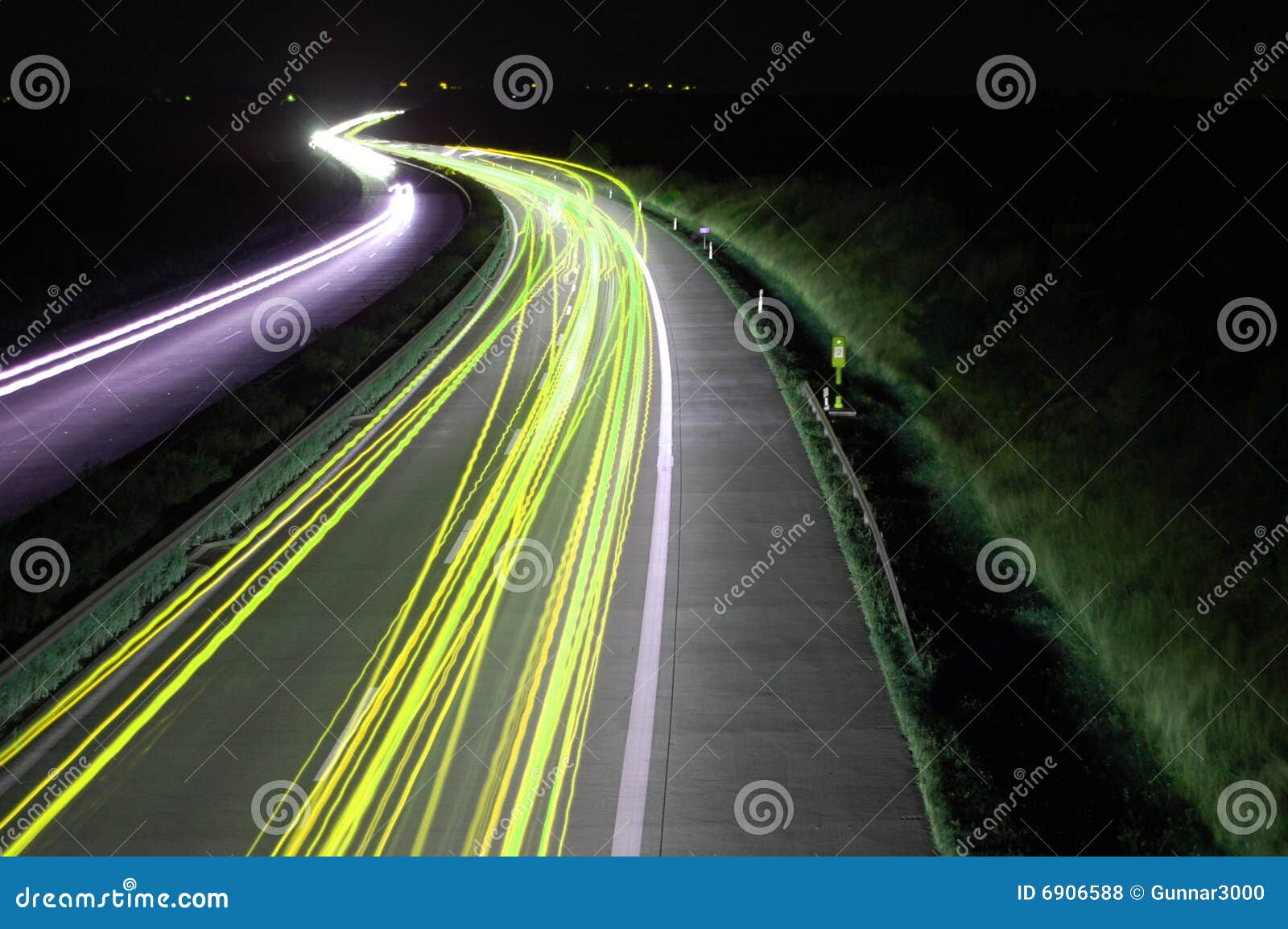 Road with Car Traffic at Night with Blurry Lights Stock Photo Image