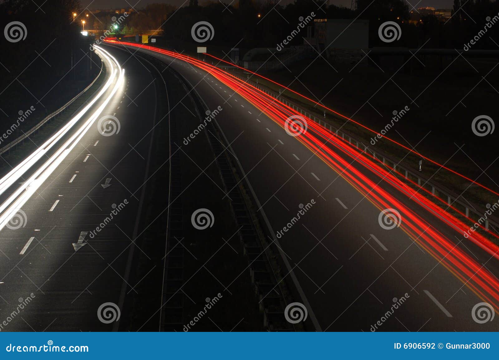 Road with Car Traffic at Night with Blurry Lights Stock Photo Image