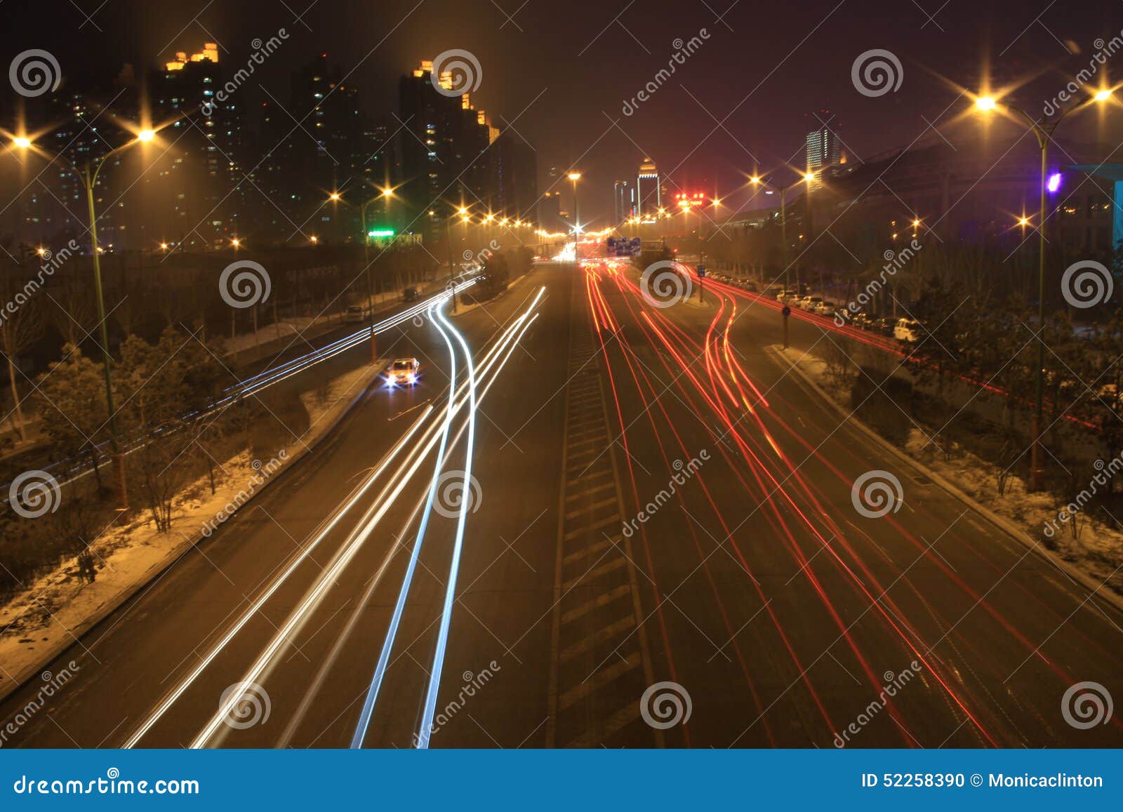 Road with Car Traffic at Night with Blurry Lights Stock Photo Image