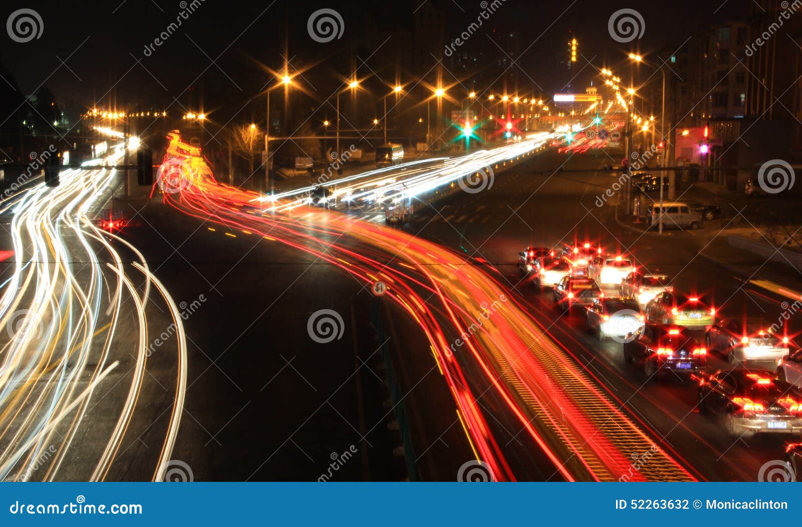Road with Car Traffic at Night with Blurry Lights Stock Photo Image