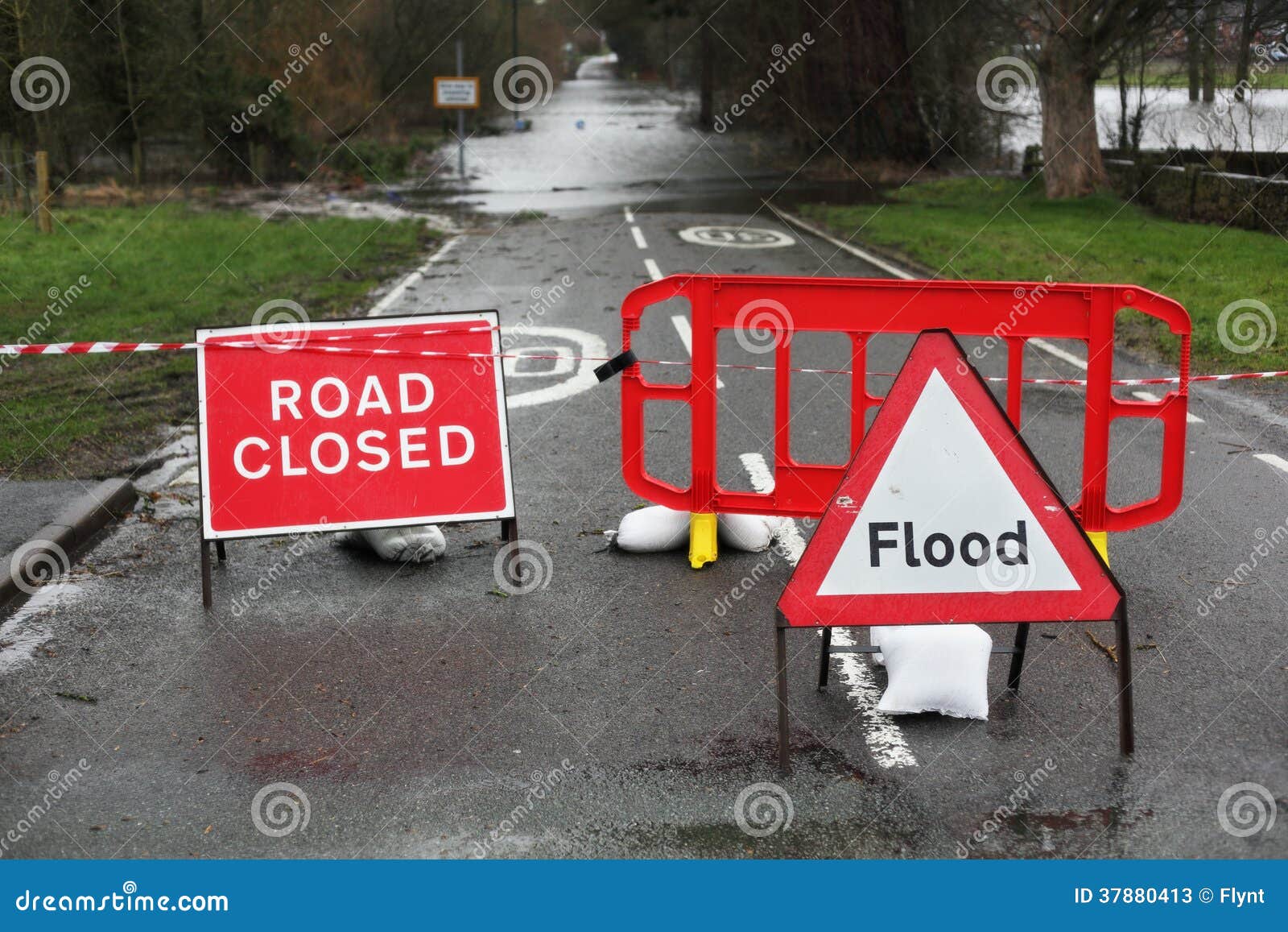 road closed and flood sign