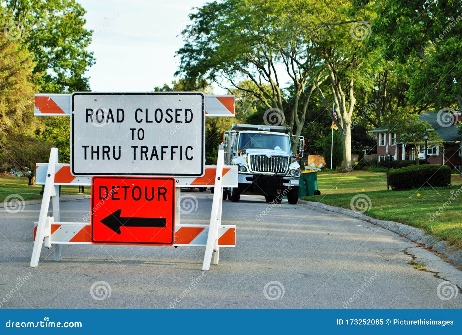 Road Closed To Thru Traffic Detour Construction Sign In A Residential