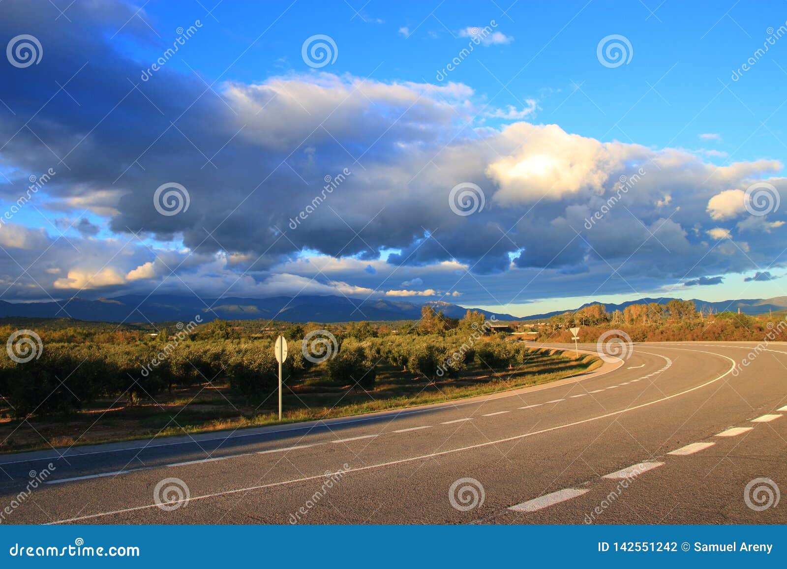 spanish road and clouds in countryside, catalunia