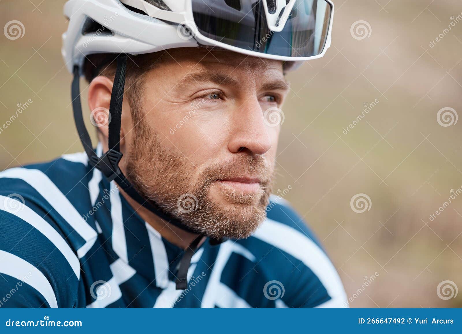 The Road is Long. a Handsome Mature Man Cycling Outdoors. Stock Photo
