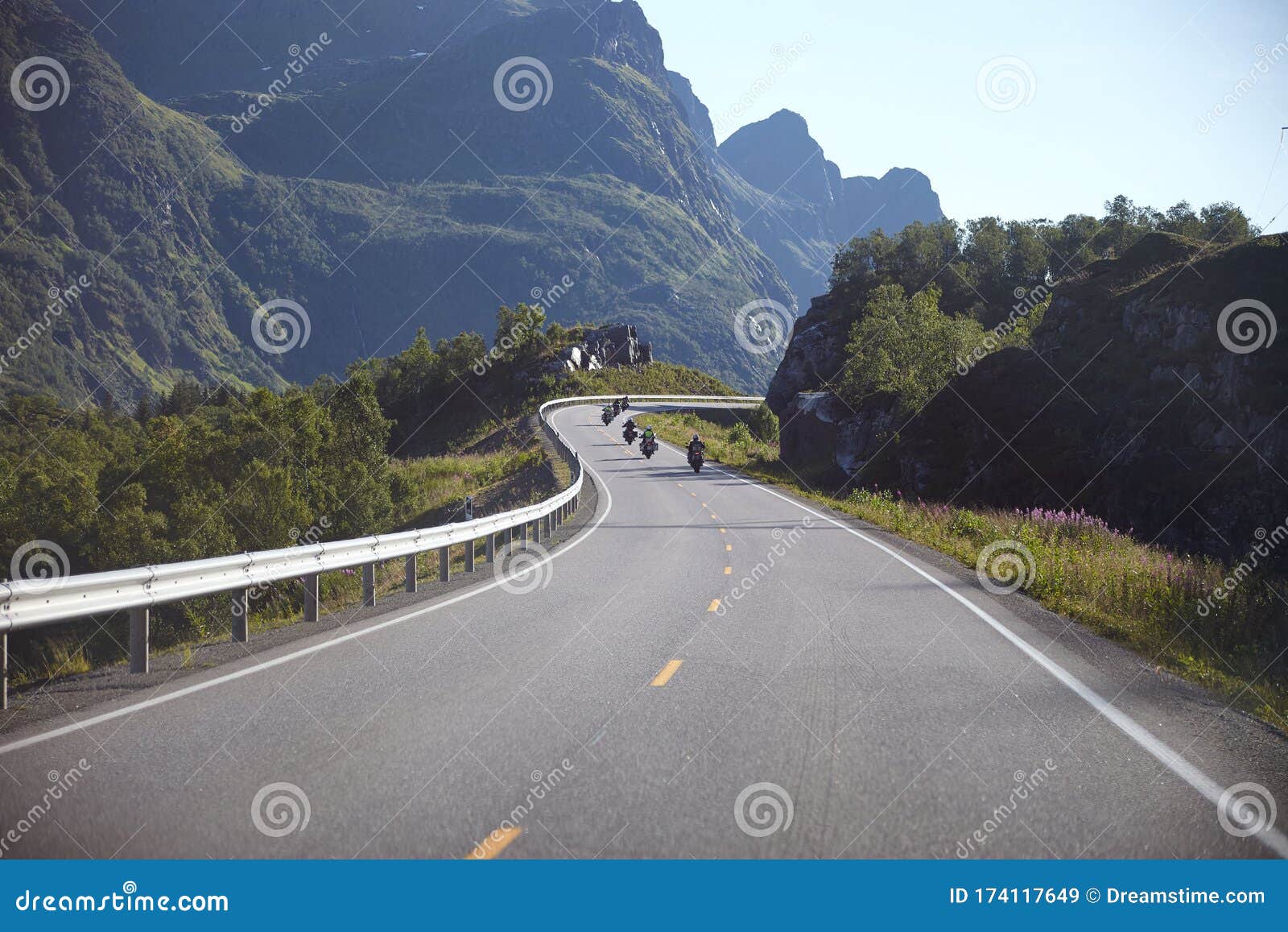 road in the mountains with a tunnel. the road goes into the tunnel, the markings on the road