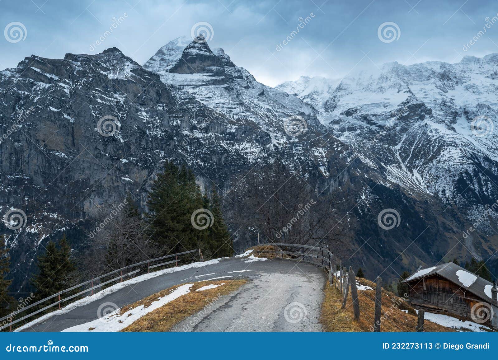 road in murren with jungfrau mountain on background - silberhorn and schwarz monch parts - murren, switzerland