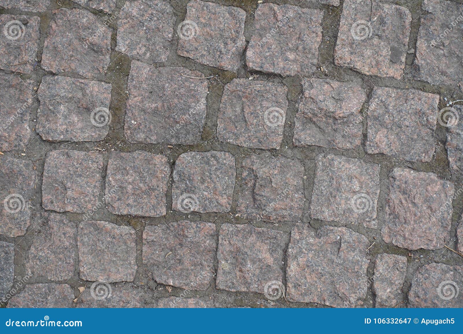road paved with rectangular granite setts