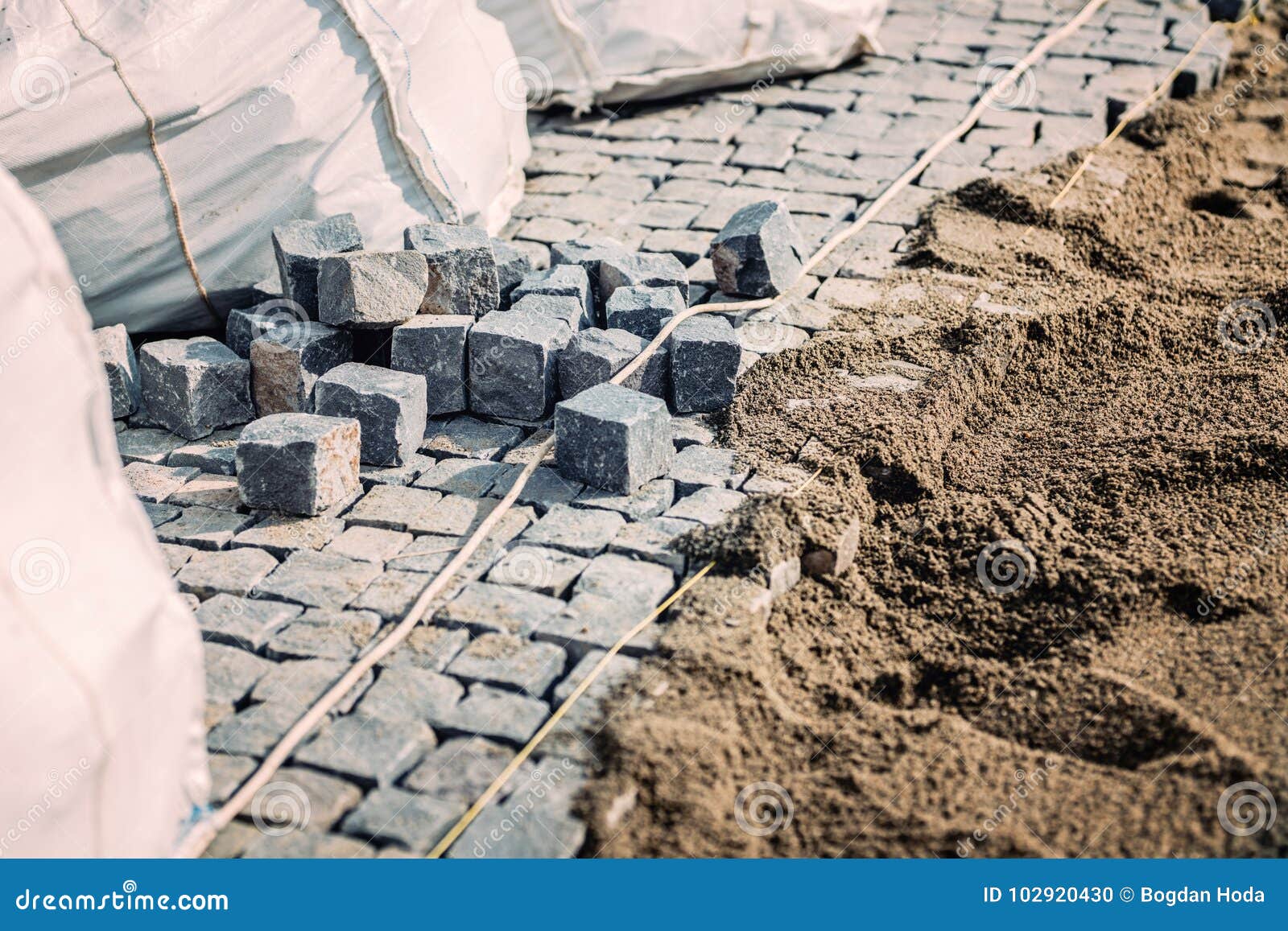 Road Pavement. Stone Granite Blocks Install Details. Cobblestone Rocks