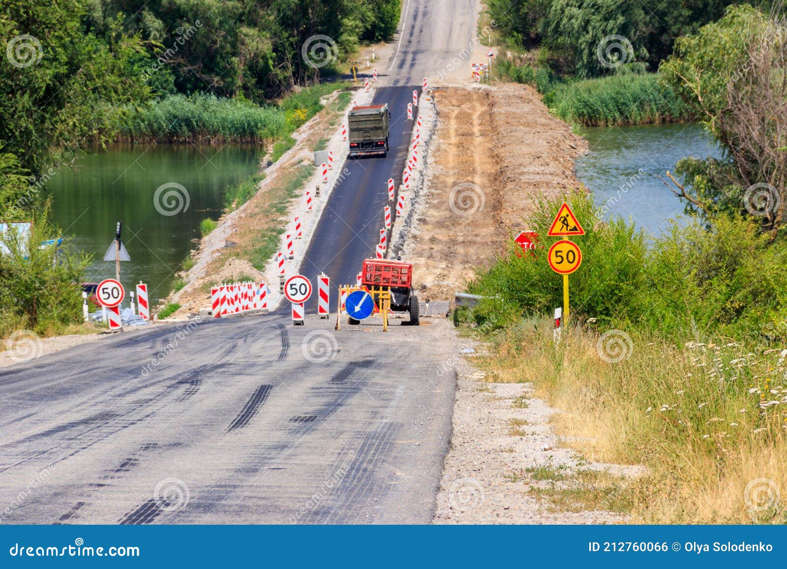 Road Repair on Dam Across the Small River Stock Photo Image of gravel