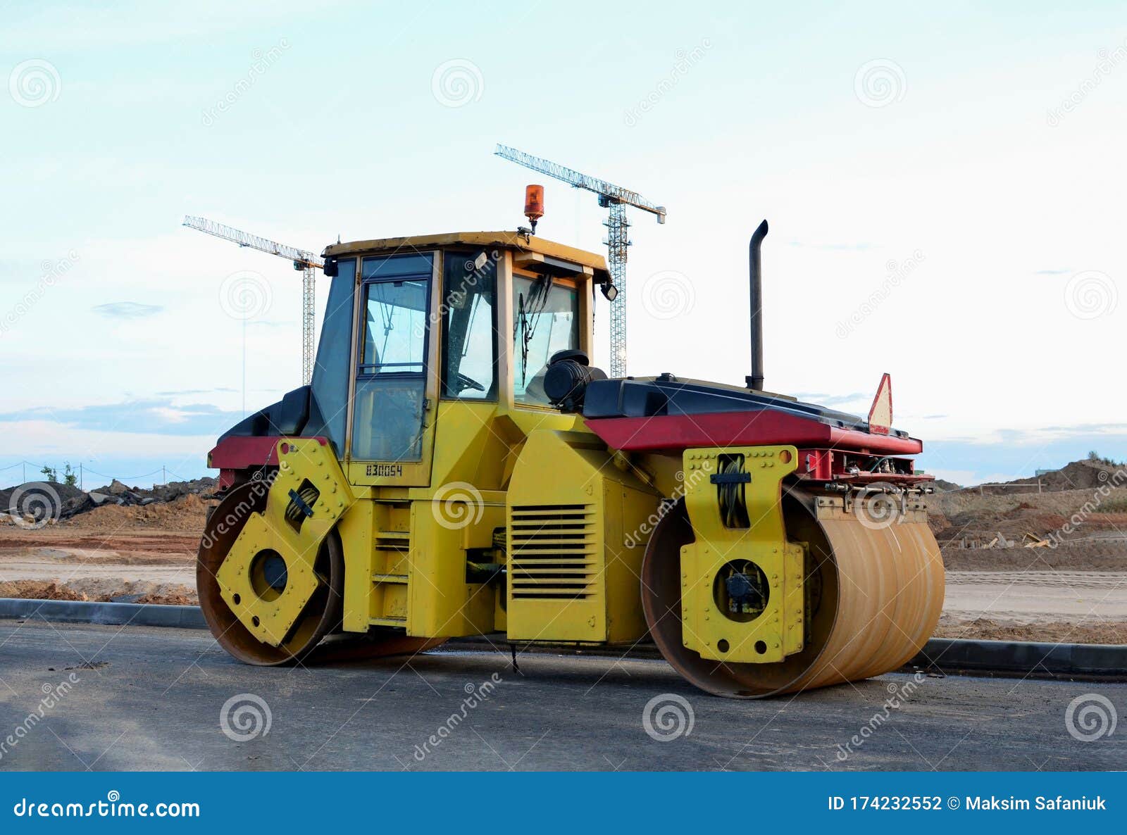 Road Roller Working at Construction Site during Asphalt Road Repair