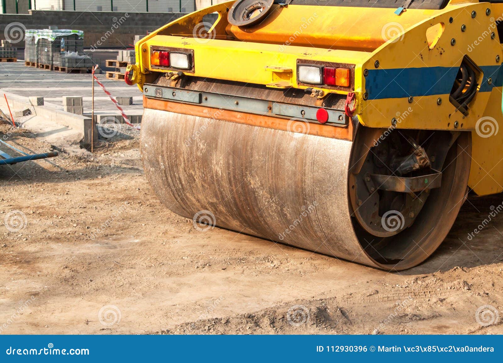 Road Roller Working at Road Construction Site. Detailed View of a Road
