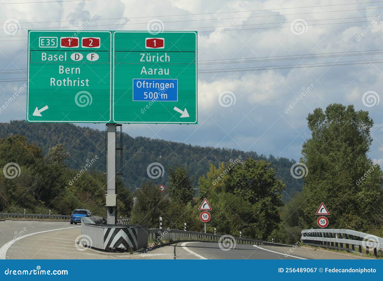 road sign of the swiss highway with directions to reach european cities