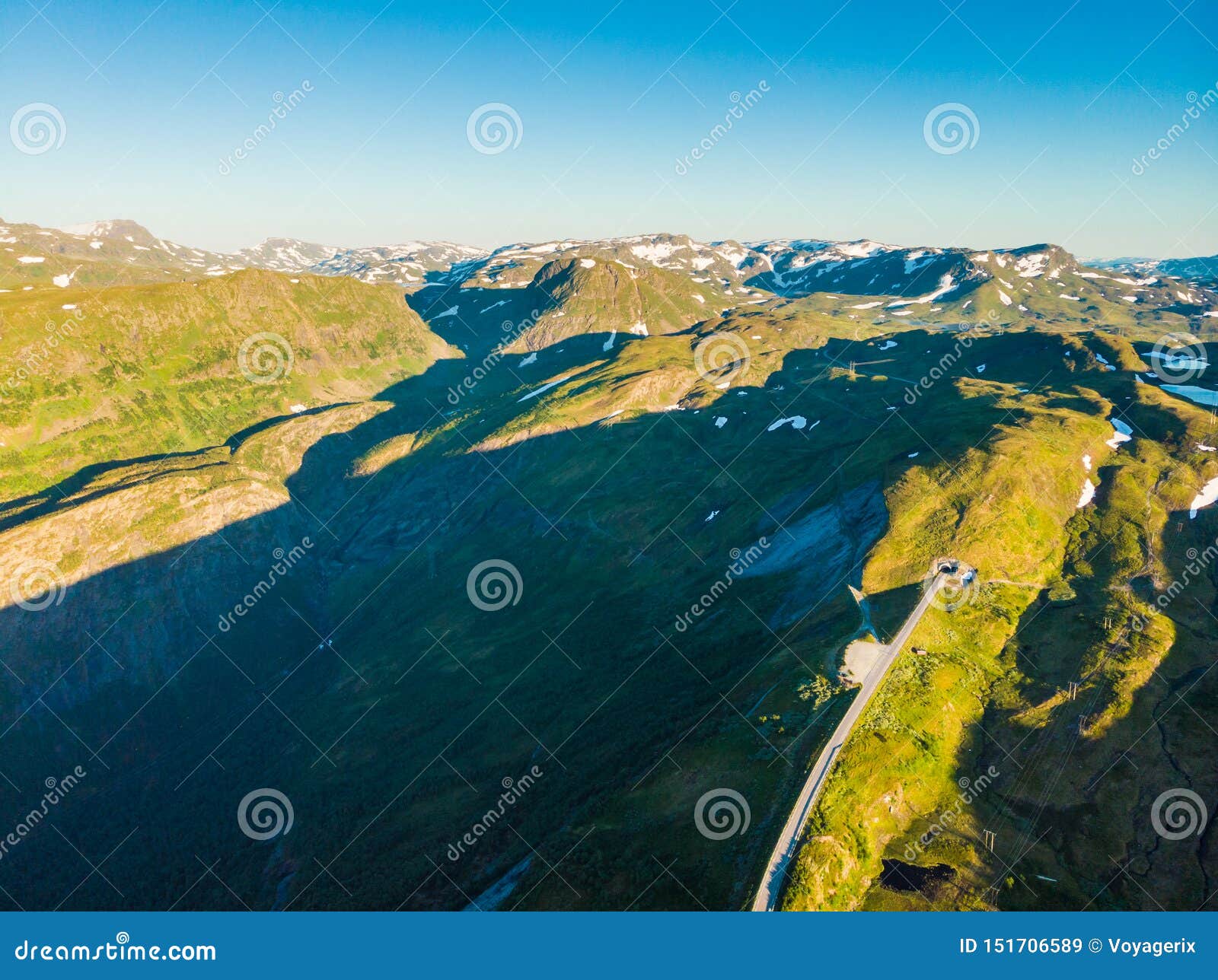 road with tunnel in mountains norway. aerial view