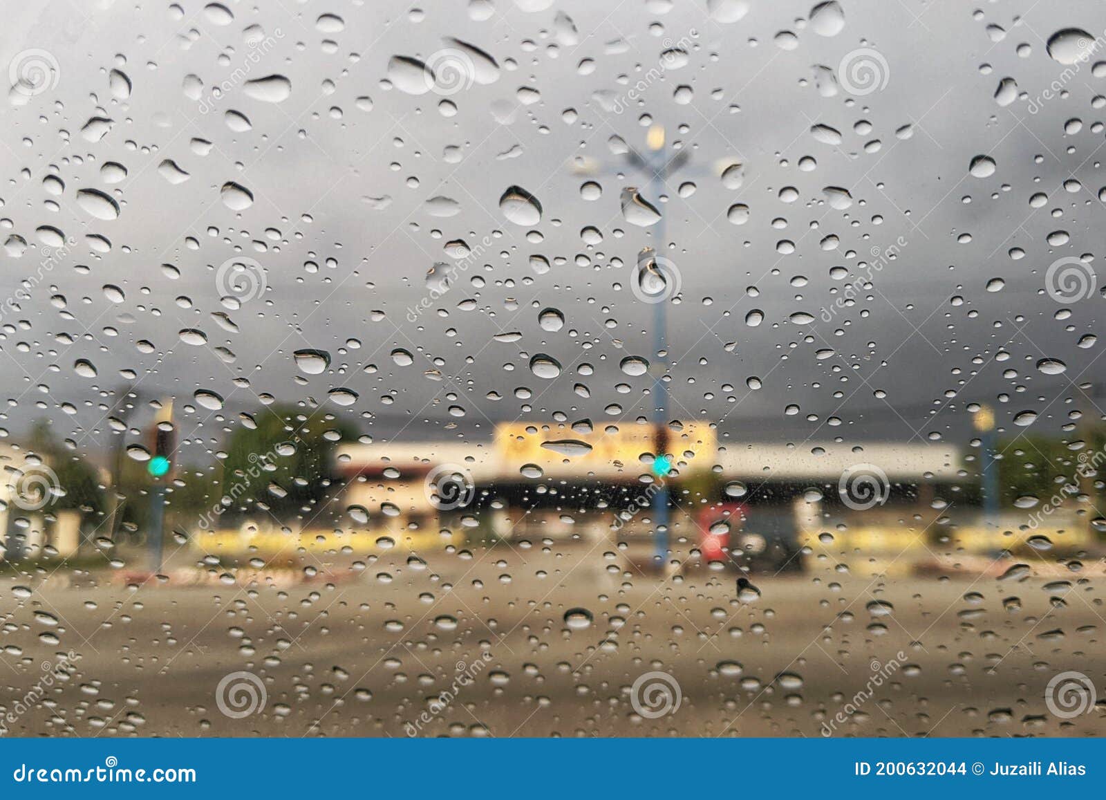 Road View through Car Window Blurry with Heavy Rain, Stock Photo