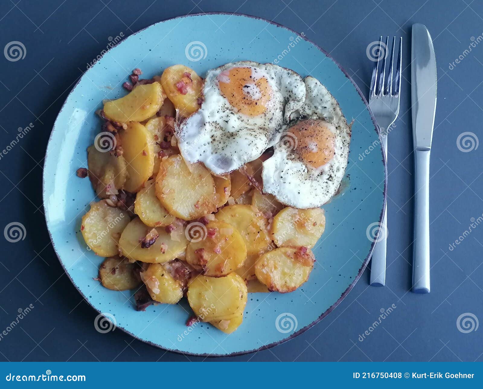 Roast Potatoes with Onions, Bacon and Fried Eggs Stock Photo Image of