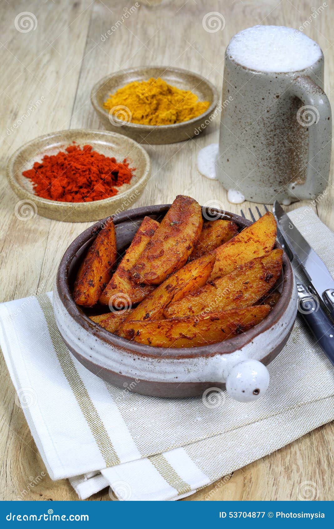 Roast Potatoes with Spices and Beer in Ceramic Beer Mug Stock Image