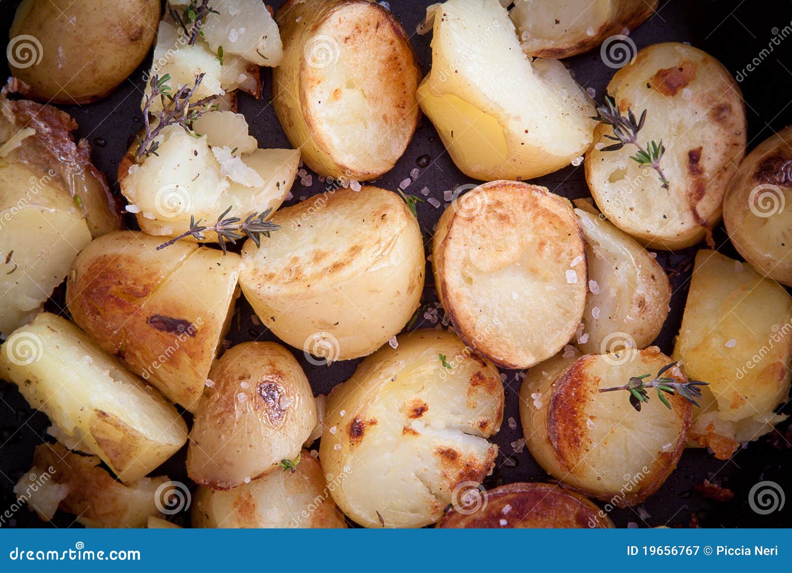 Roast potatoes with thyme stock image. Image of salt 19656767