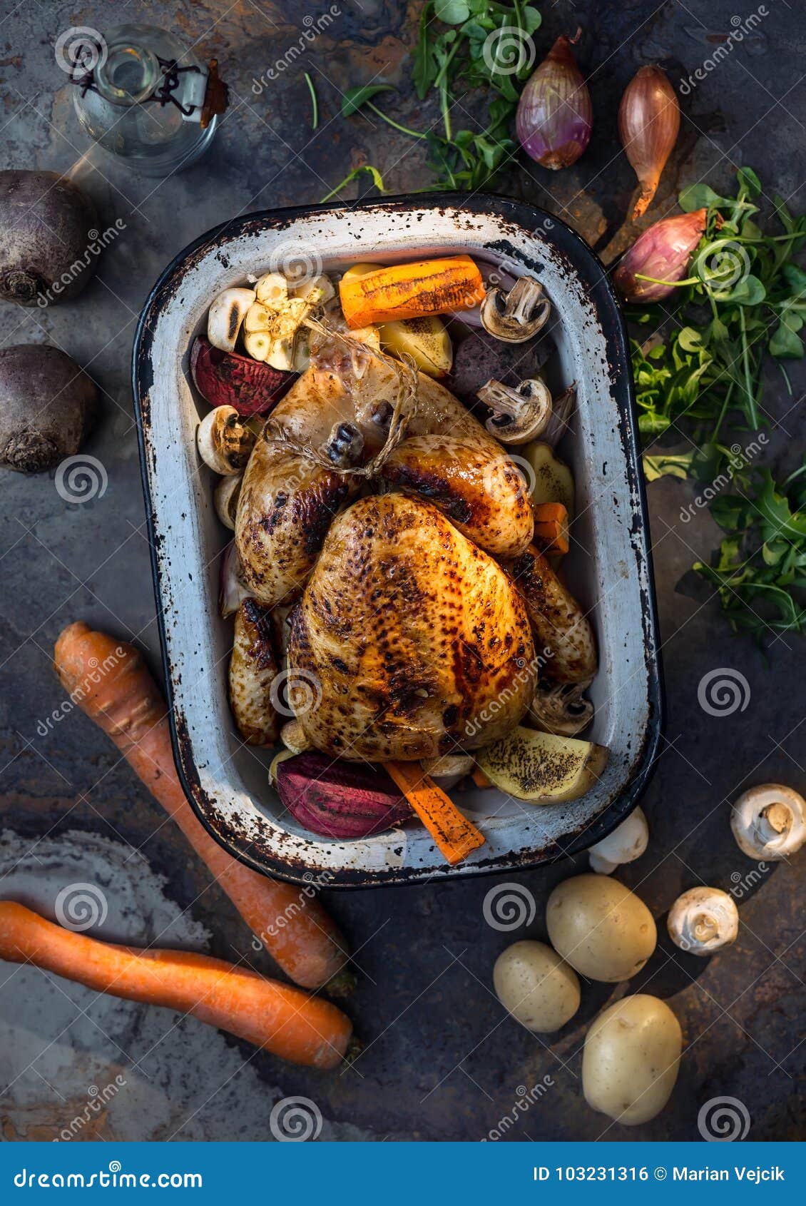 Roast Whole Turkey or Chicken in Old Pan with Vegetables Stock Photo