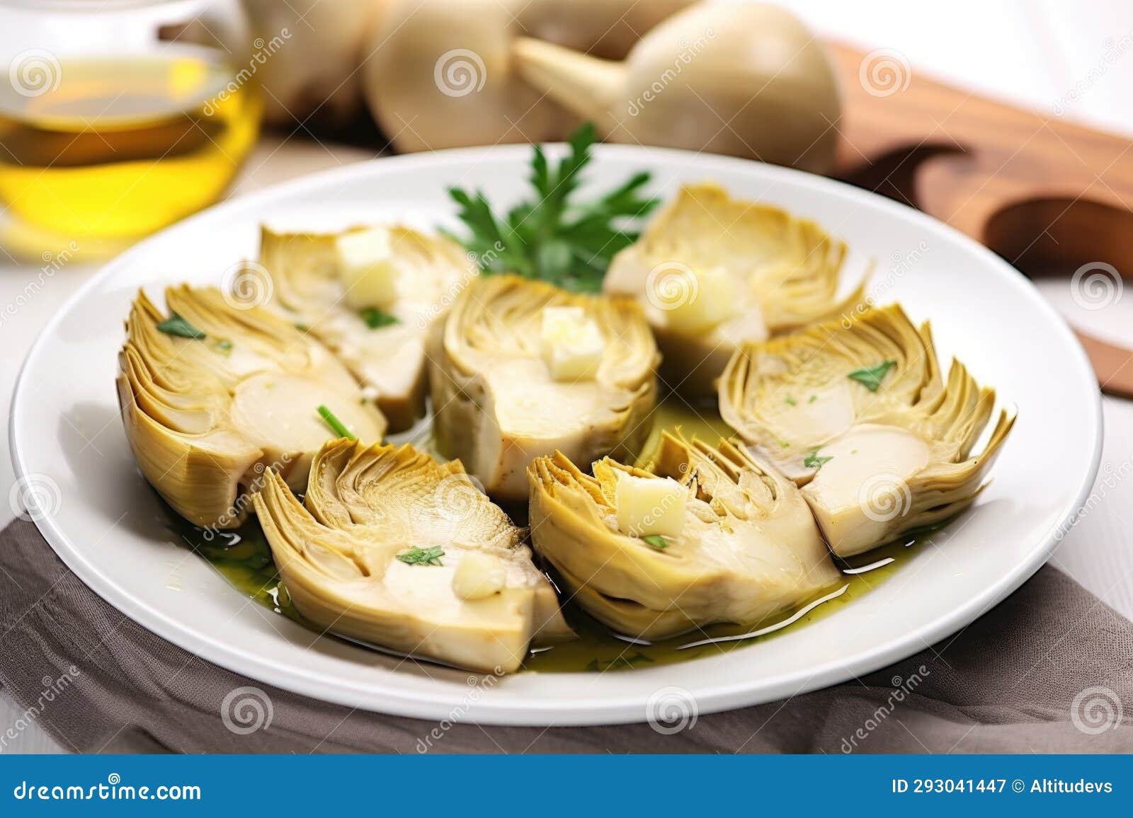 Roasted Artichoke Hearts Served on a White Ceramic Plate Stock Image