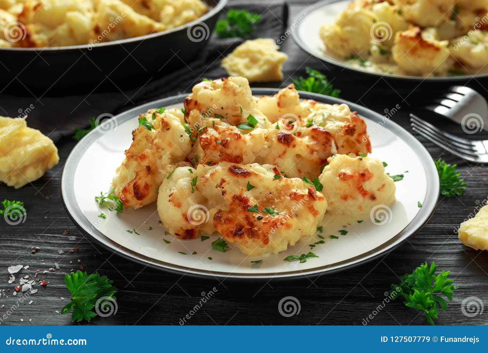 Roasted Cauliflower with Cheddar Cheese Sauce and Herbs. Stock Image