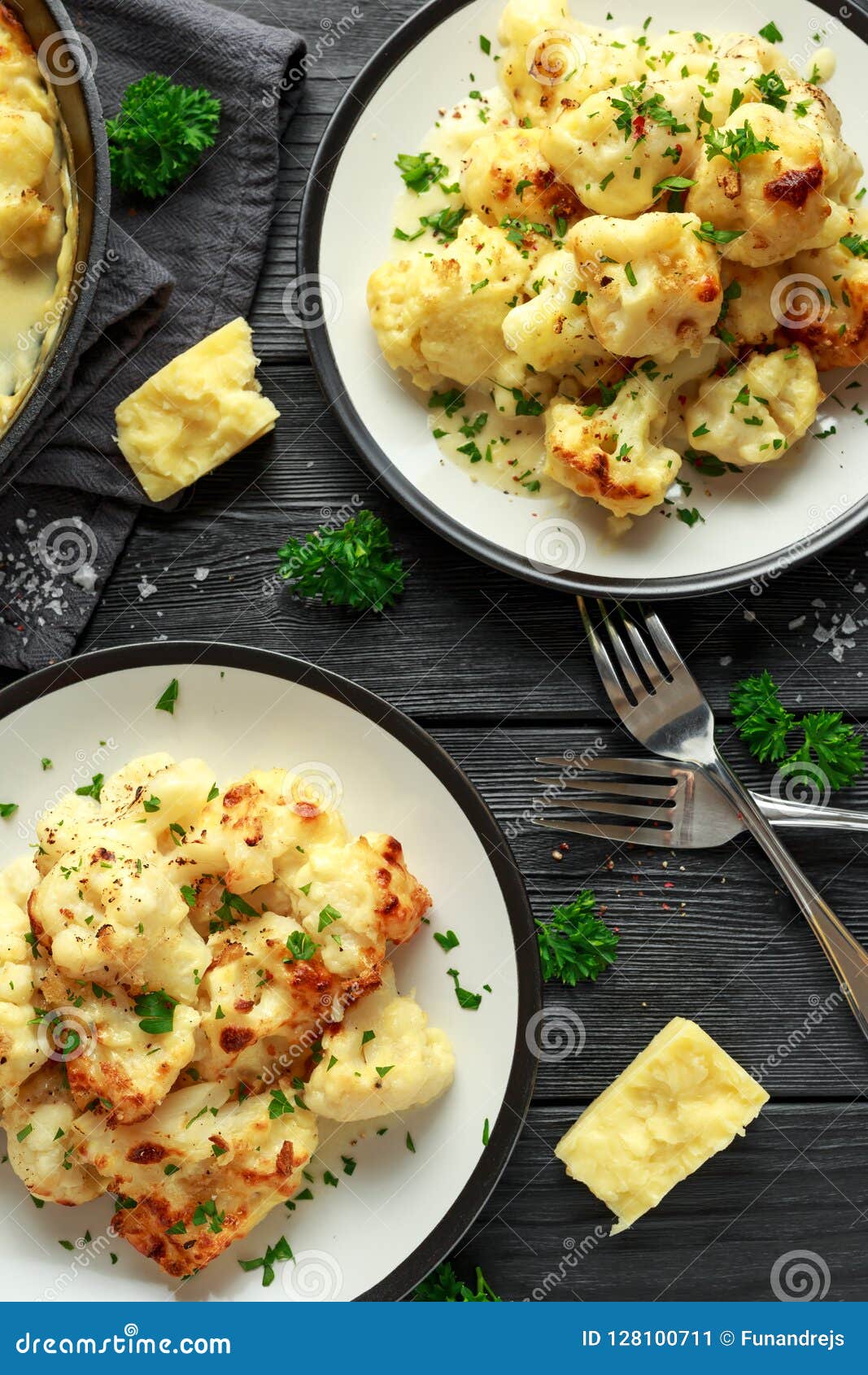 Roasted Cauliflower with Cheddar Cheese Sauce and Herbs. Stock Image