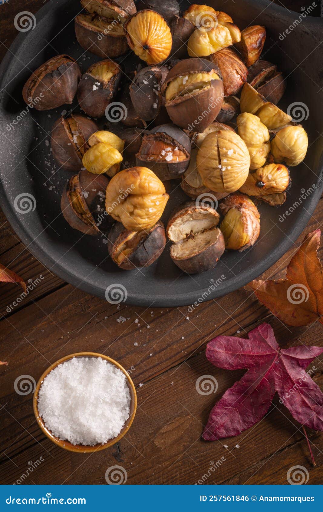 Roasted Chestnuts in Cast Iron Pan on an Old Board Stock Photo Image