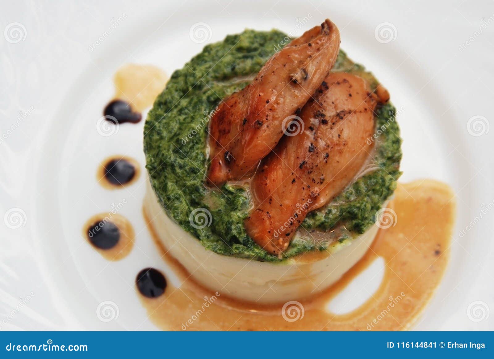Roasted Chicken Breast and Mashed Potatoes with Spinach Sauce in White Plate. Top View. Stock