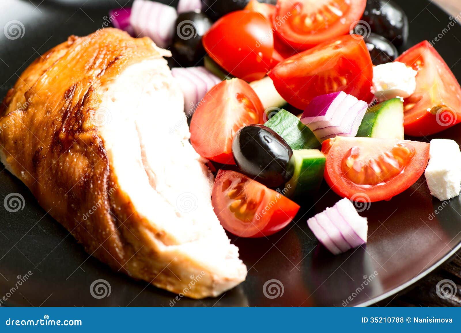 Roasted Chicken Breast with Vegetables in Plate Close Up Stock Photo