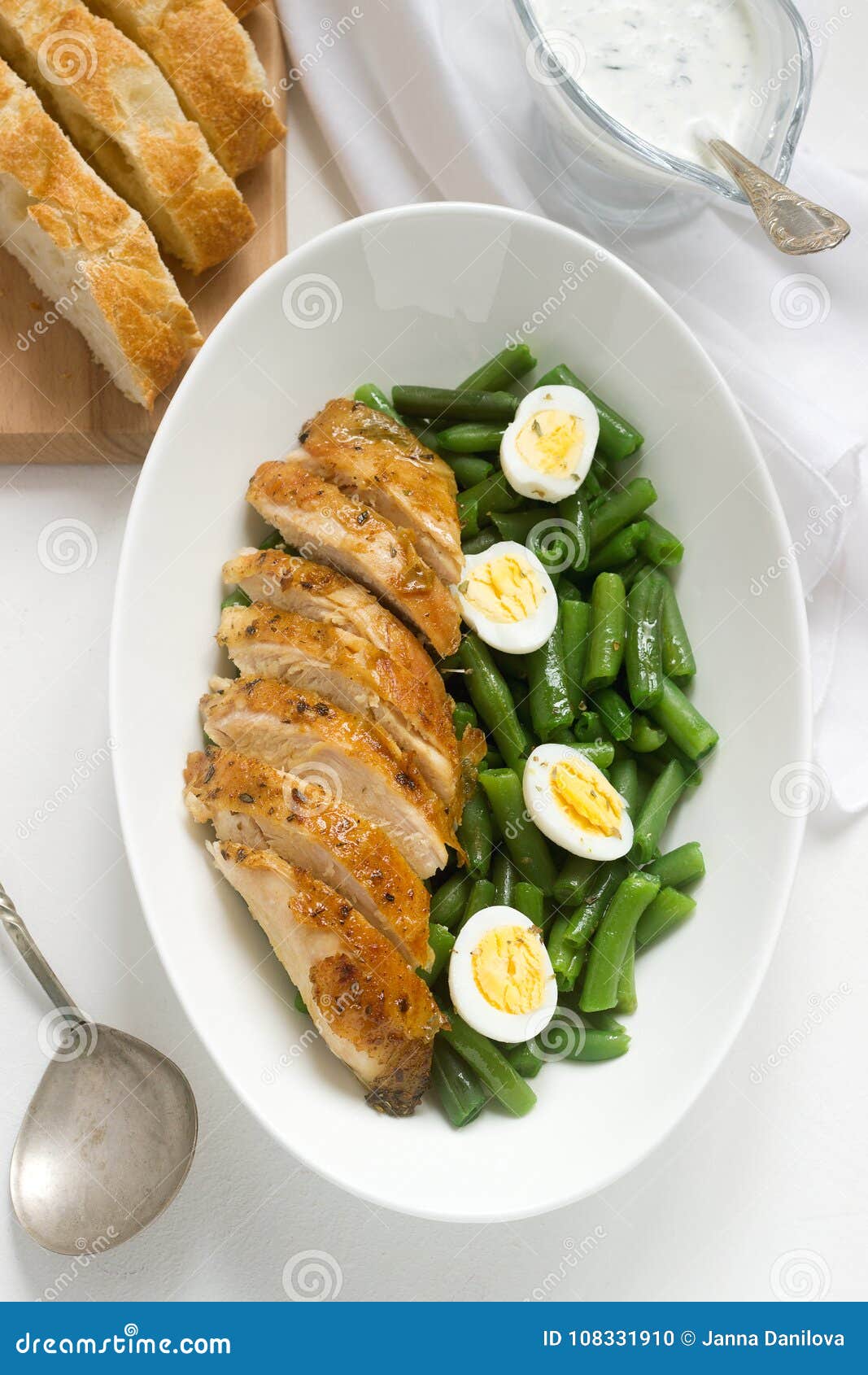 Roasted Chicken Breasts Served with Fried Egg and Boiled Green Beans