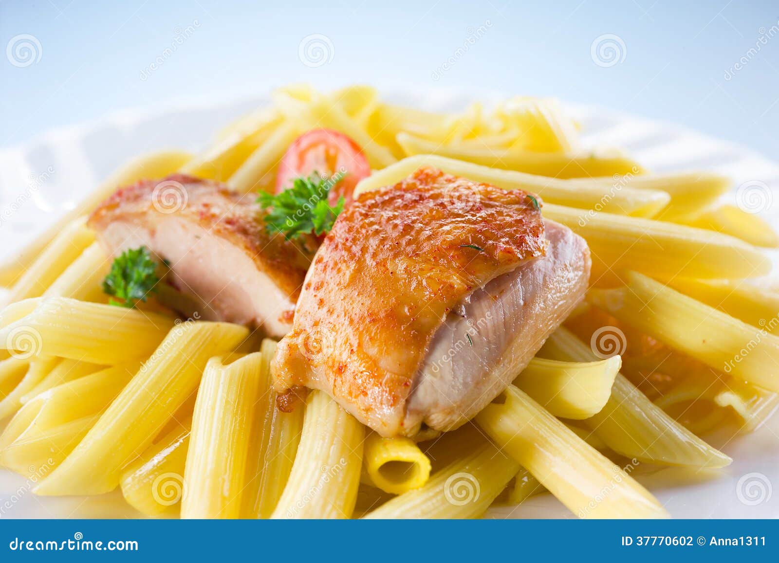 Roasted chicken with pasta stock photo. Image of food 37770602