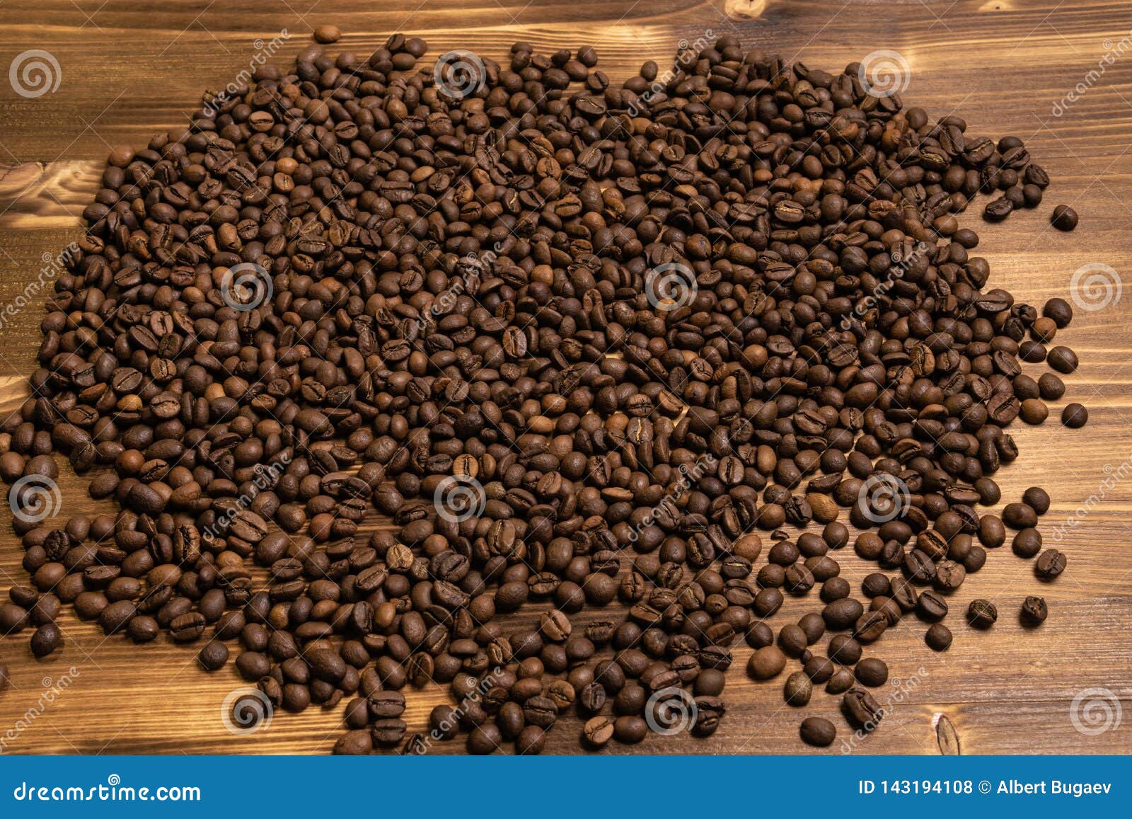 Roasted Coffee Beans in Bulk on a Wooden Background Stock Photo Image