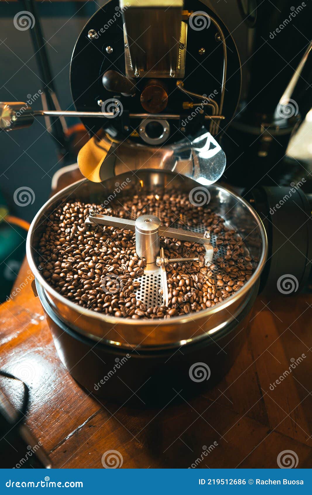 Roasted Coffee Beans in the Machine at a Coffee Shop Stock Photo