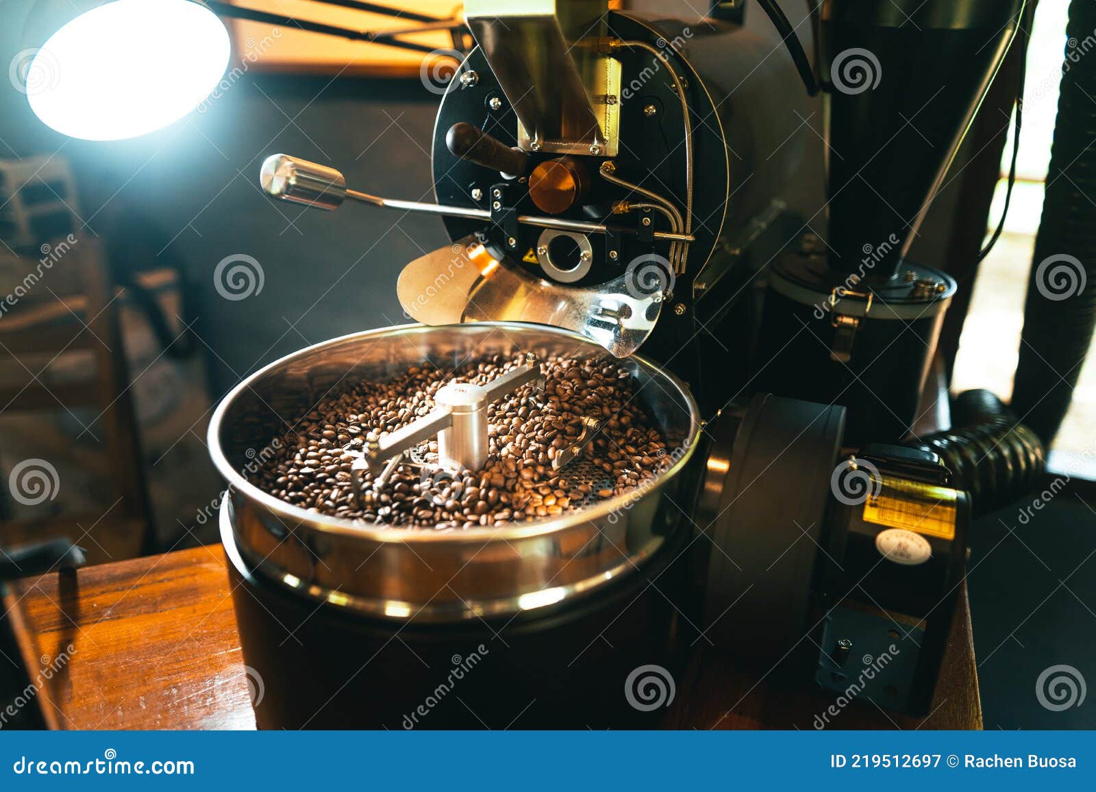 Roasted Coffee Beans in the Machine at a Coffee Shop Stock Image