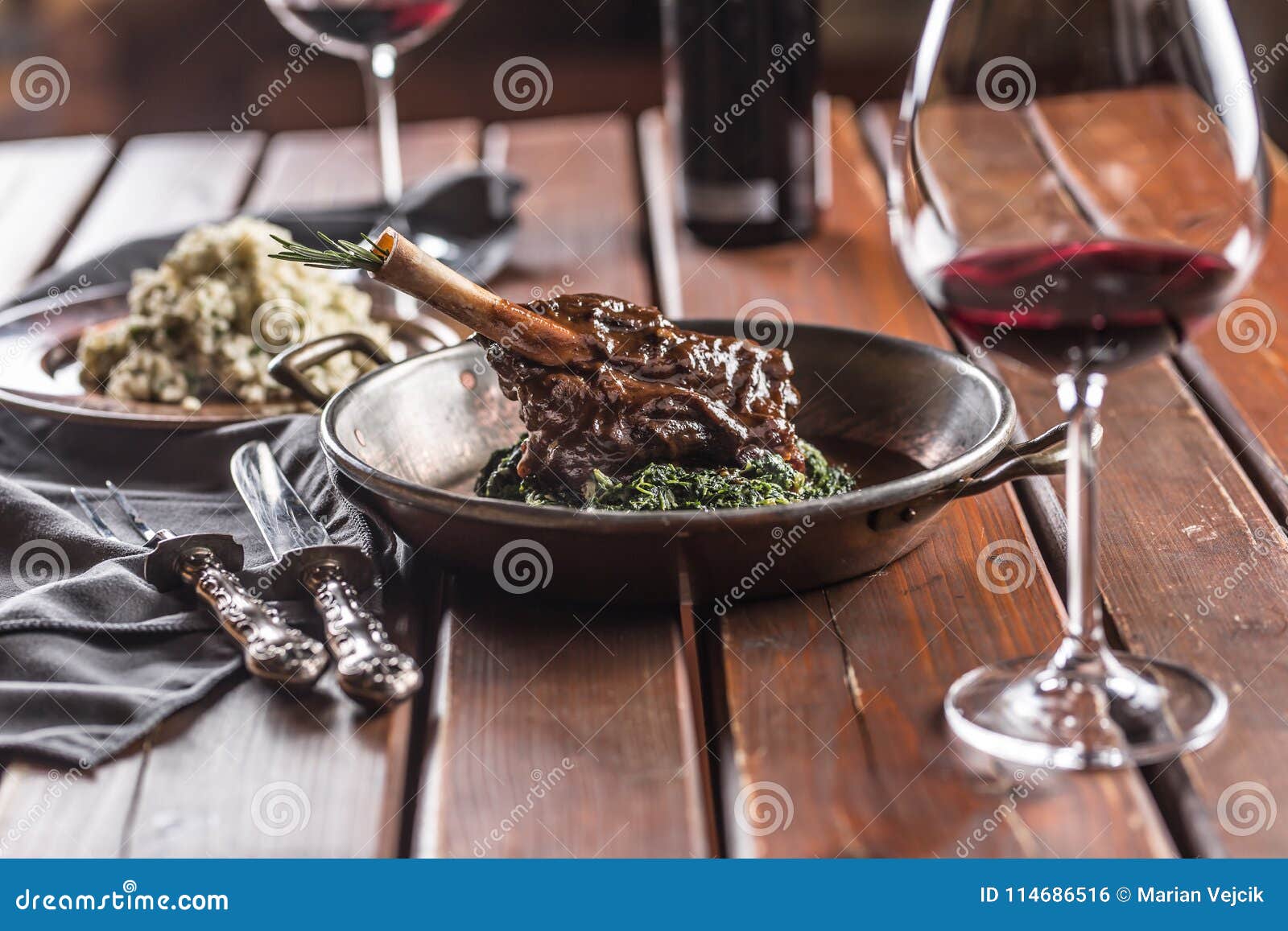 Roasted or Confit Lamb Leg in Pan with Spinach and Red Wine Stock Photo Image of fried, dinner