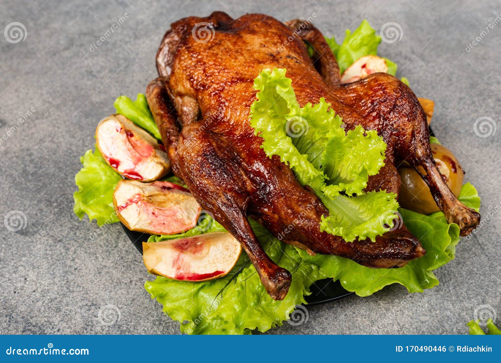 Roasted Duck With Apples, Herbs On A Grey Background. Christmas Symbolic Food. Close-up. Stock