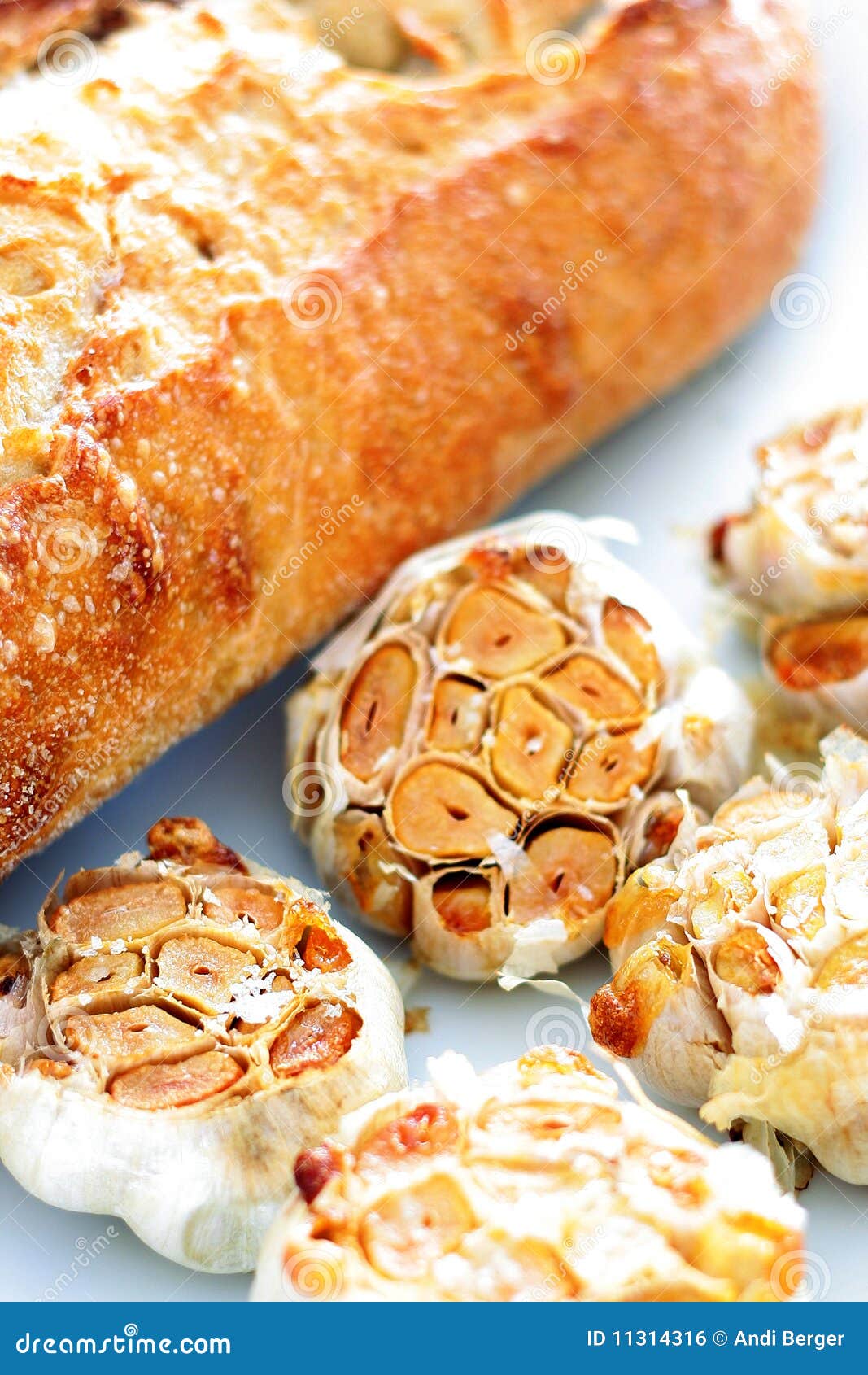 Roasted Garlic with a Fresh Baked Baguette Stock Photo Image of salt