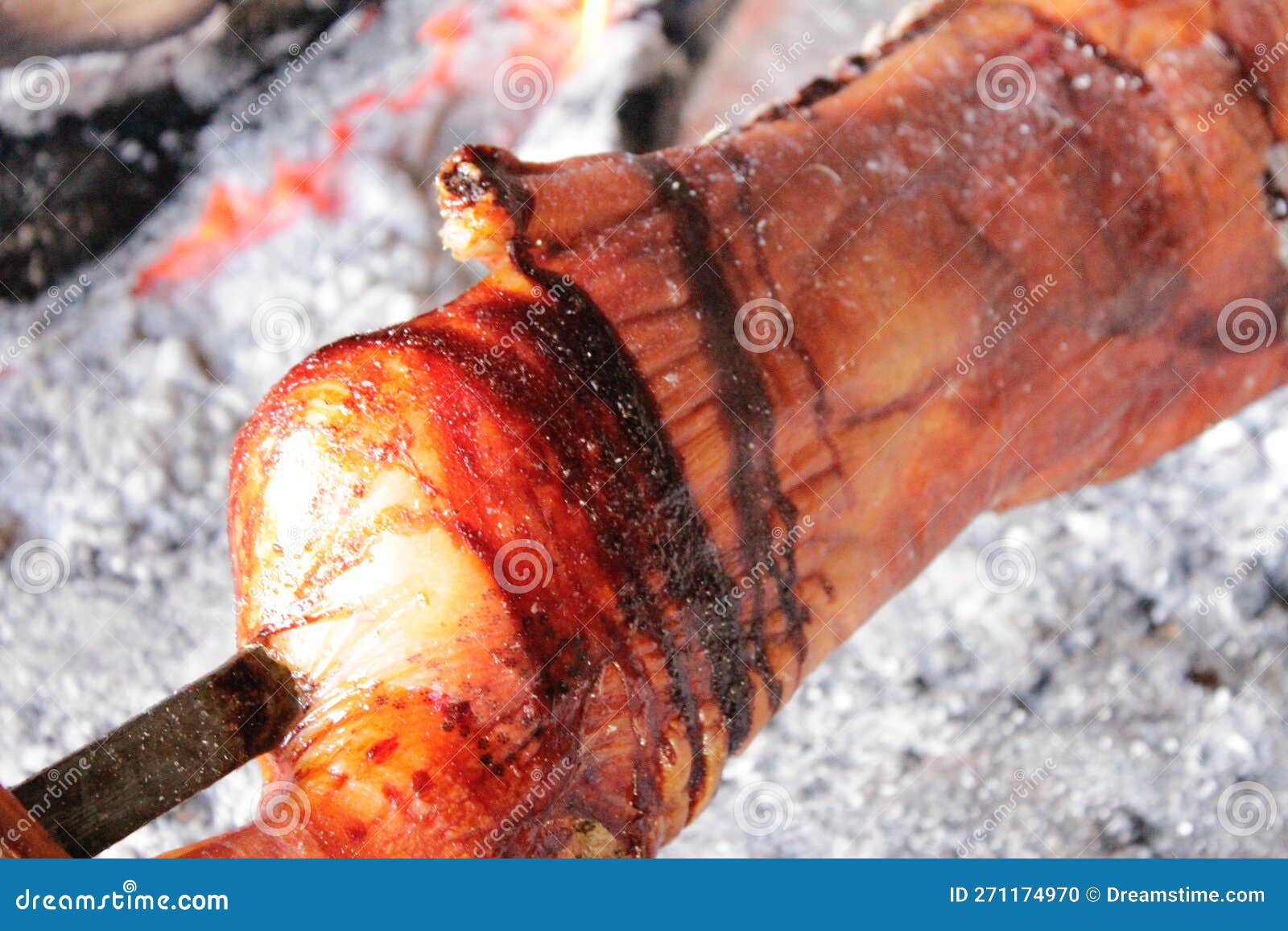 porceddu, suckling pig or piglet. cooked over a wood fire on a grill