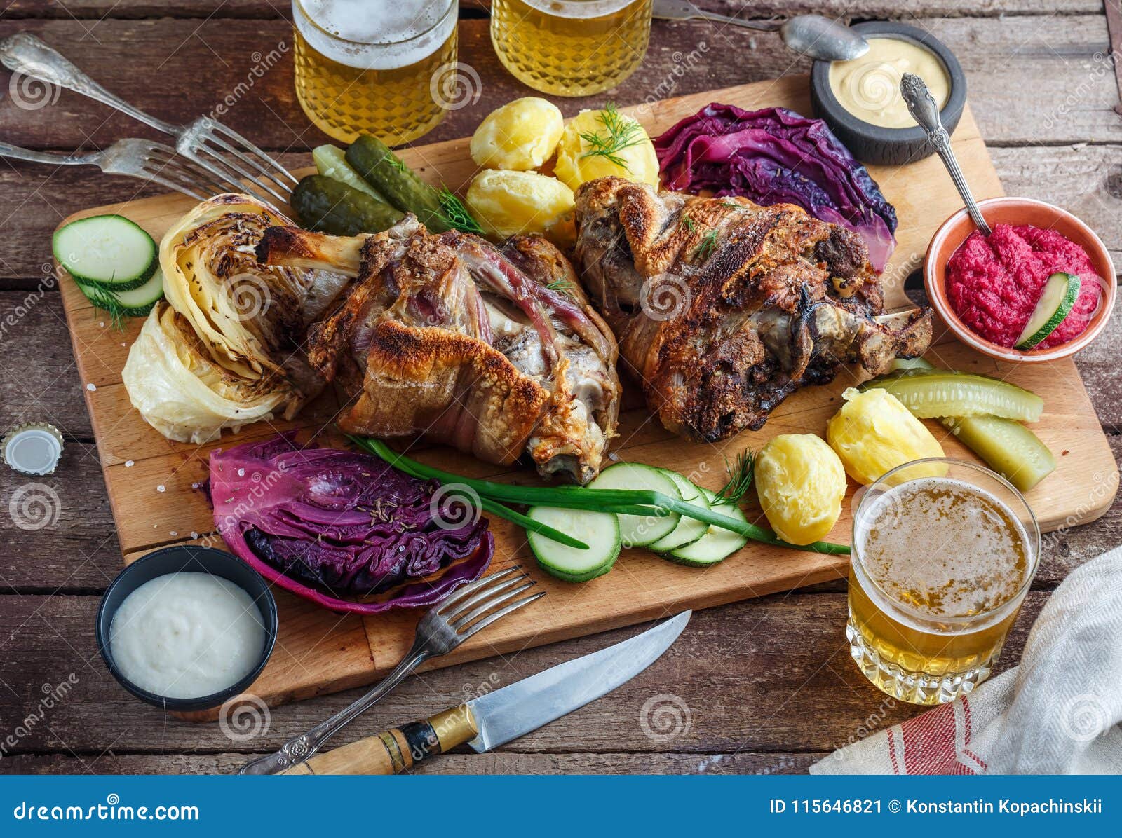 Roasted Pork Knuckle Eisbein with Beer and Assorted Snacks Stock Image