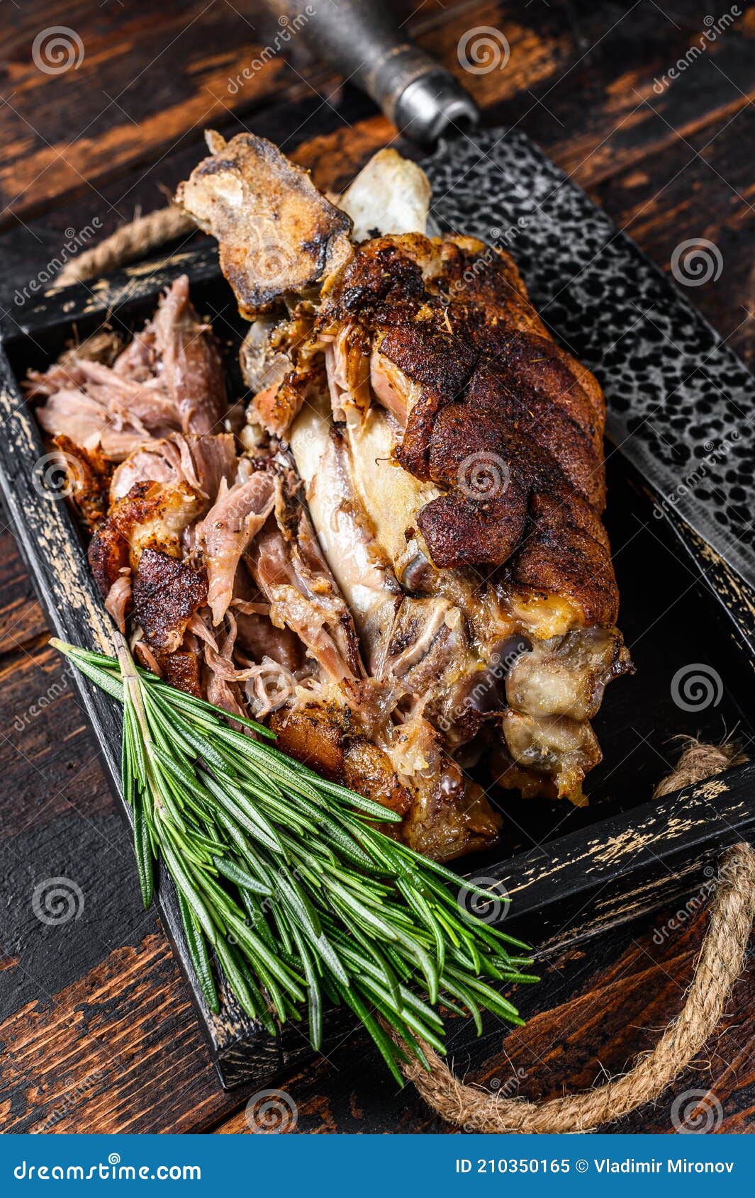 Roasted Pork Knuckle Eisbein Meat in a Wooden Tray with Knife. Dark ...