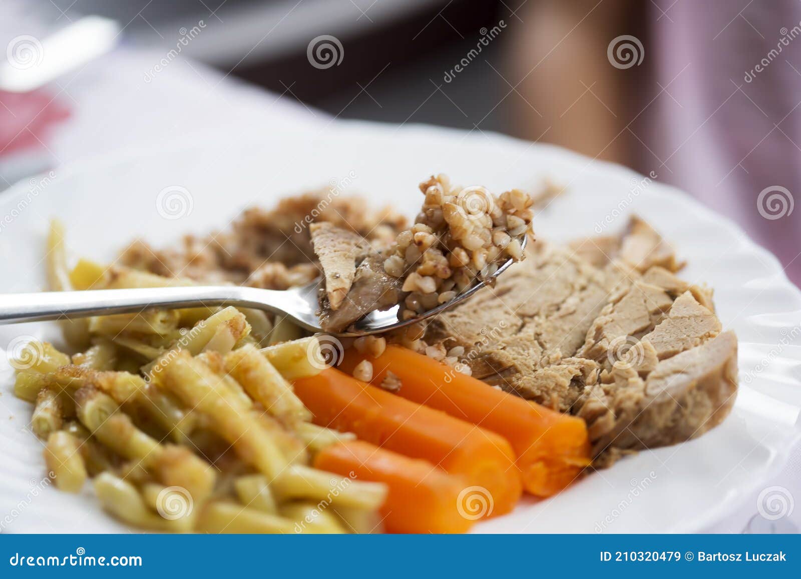 Roasted Pork Shoulder with Buckwheat, Cooked Beans and Carrots Stock