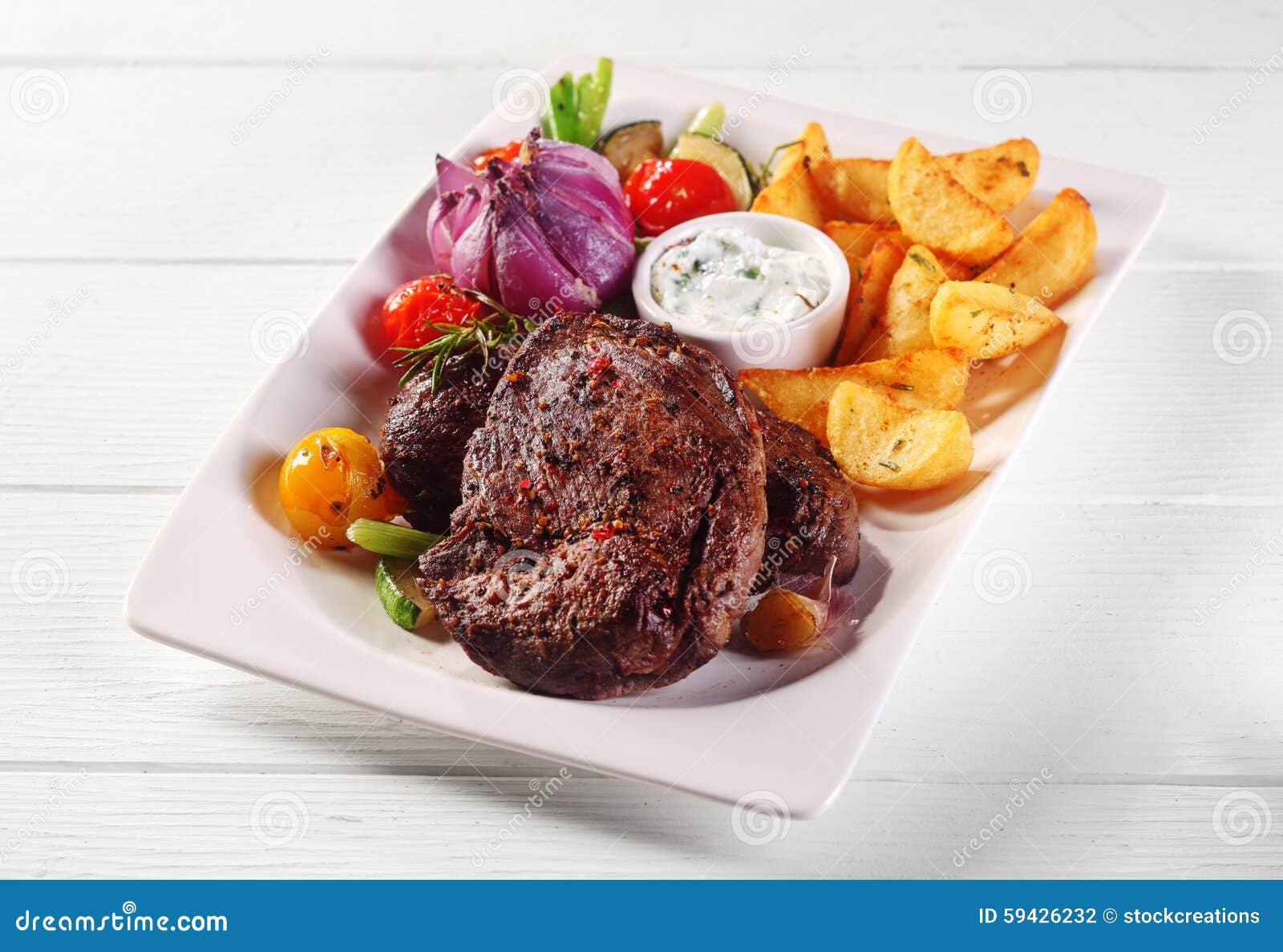 Roasted Steak And Potato Wedges Main Dish Stock Photo - Image of
