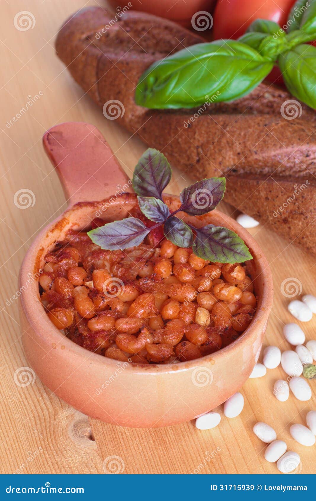 Roasted White Kidney Beans with Tomatoes and Basil in a Pot Stock Image