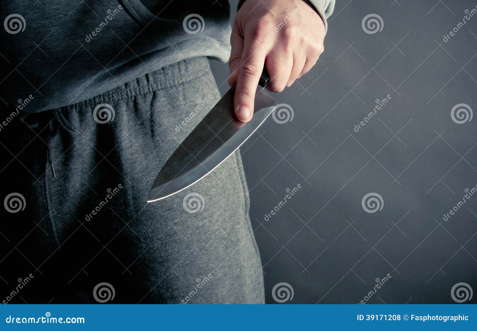 Robber Thrusting a Large Knife Stock Photo Image of looking, killer