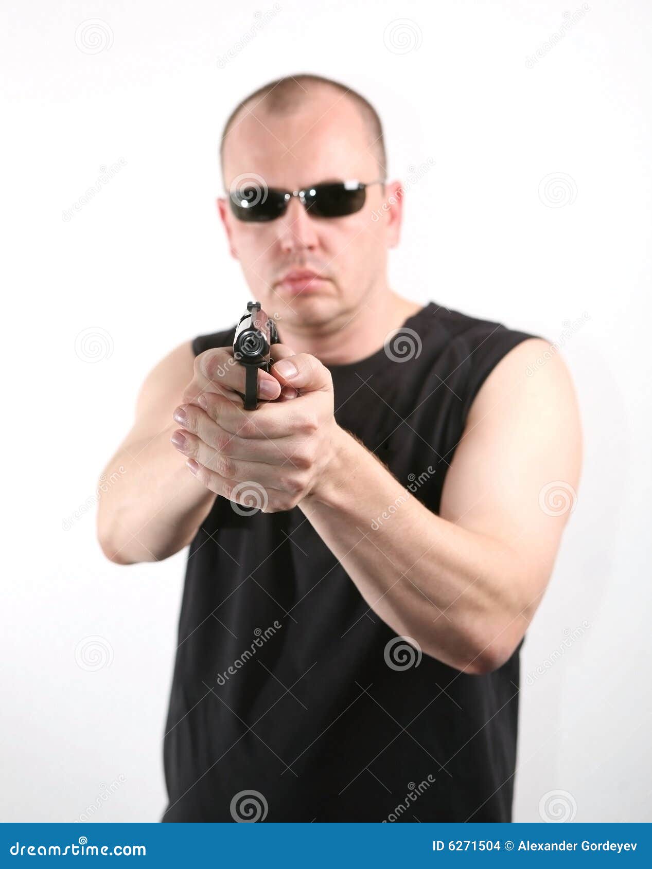 Robbery in store. Robber is aiming and threatening with gun in shop. Stock  Photo