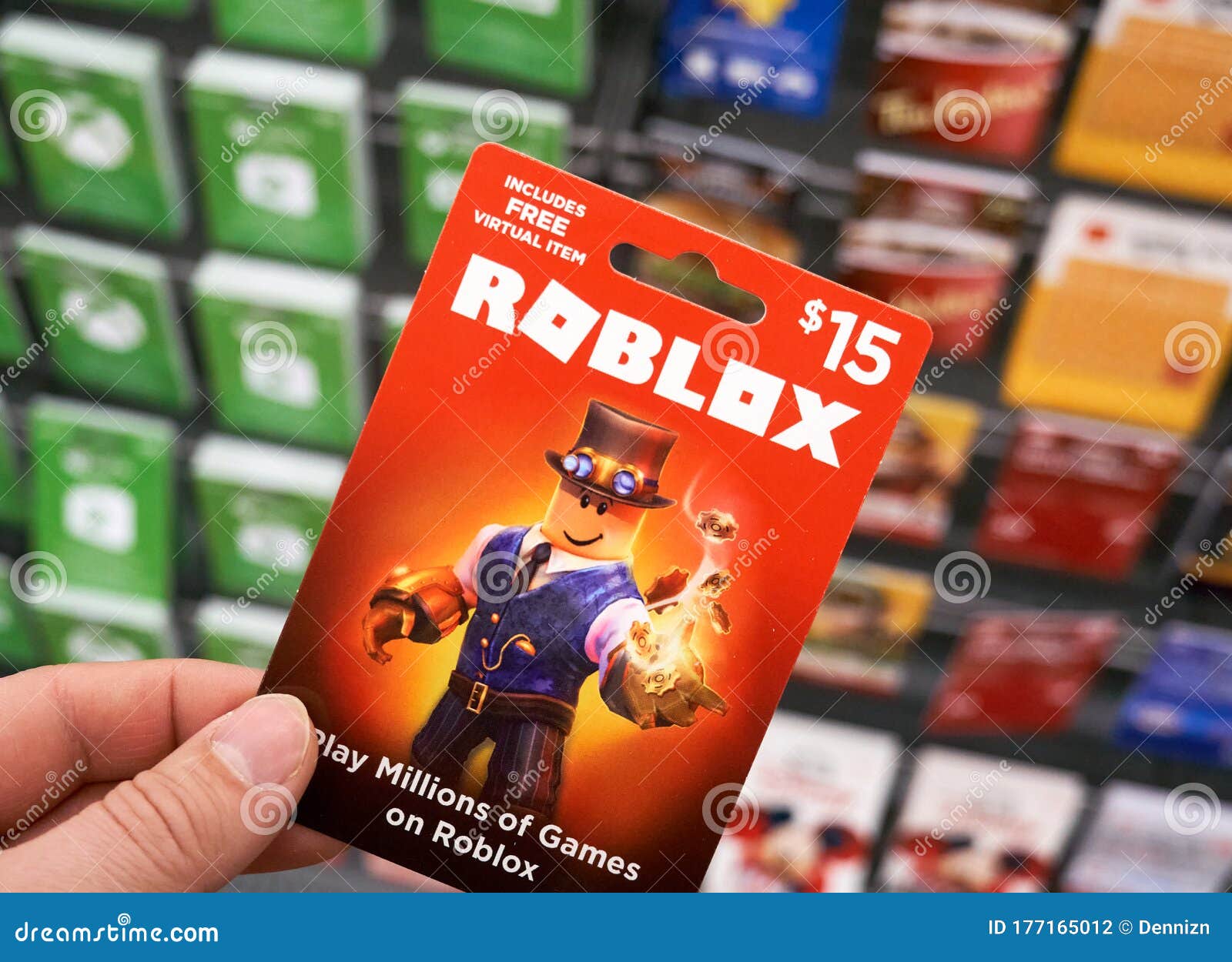 Roblox Gift Card In A Hand Over Gift Cards Background Editorial Photography Image Of Company Popular 177165012 - roblox playing cards