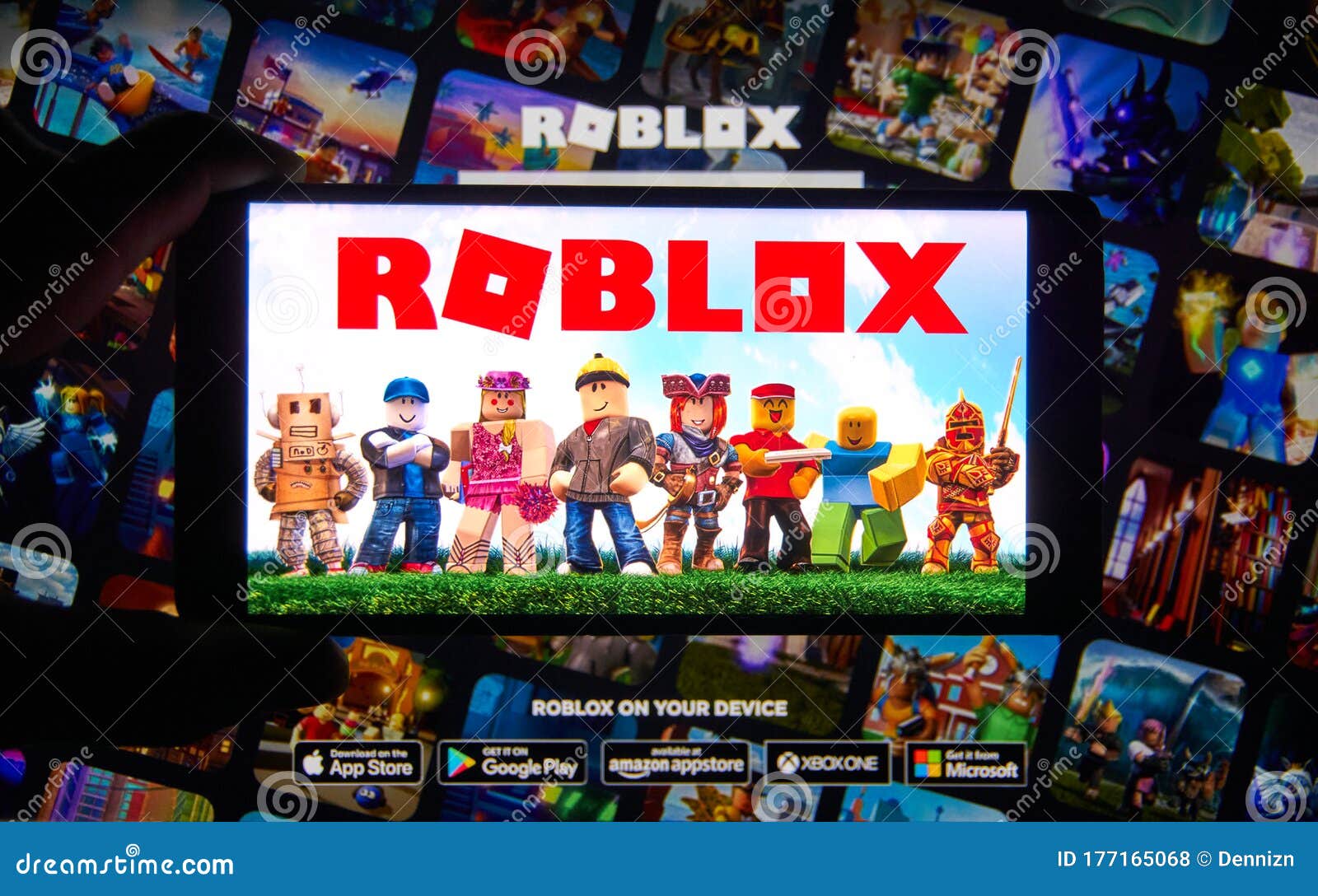 Roblox Logo and App on a Mobile Screen in a Hand Editorial Stock