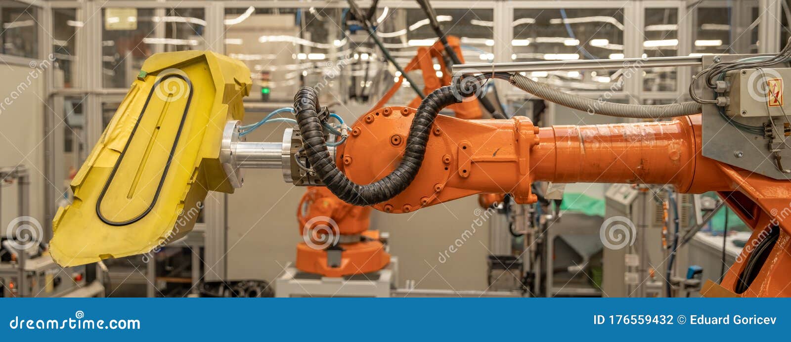 Robot Arms in the Factory Performs Precise Work According To the