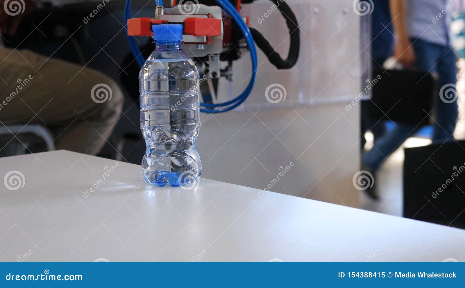 Robot Hand is Holding a Bottle of Water. Media. Technological Progress