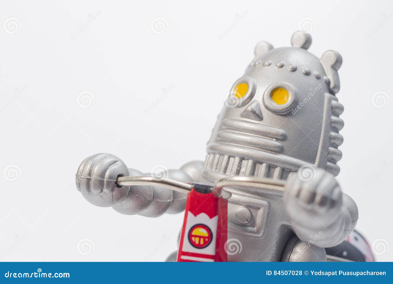 A Robot Toy is Riding Bicycle Stock Photo Image of concept, symbol